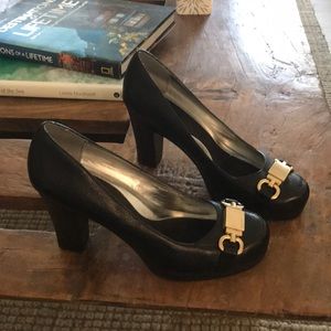 Calvin Klein 3 3/4 black heels with gold buckle.